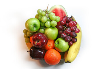 Naklejka na ściany i meble A variety of fresh fruit on one plate.