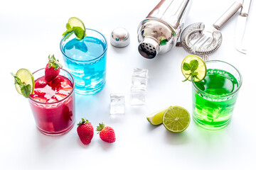 Mix of cocktails cold drink with ingredients and bar tools