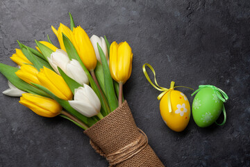 Easter greeting card with easter eggs and tulip flowers