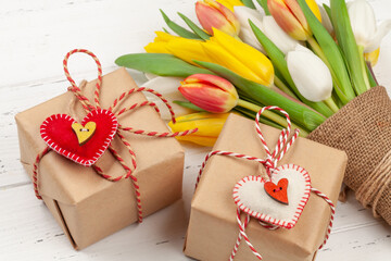 Colorful tulip flowers bouquet and gifts