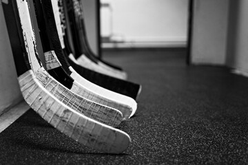 Hockey sticks in the locker room hallway before the game