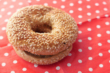 fresh bagel bread in a paper on table 