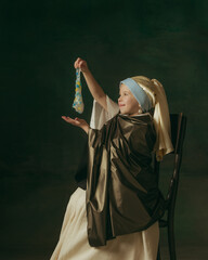 Slime. Medieval little girl as lady with a pearl earring on dark studio background. Concept of comparison of eras, childhood, ancient. Stylish, creative, art vision, new look of artwork.