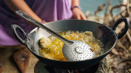 Thekua being prepared on stove before chhath puja