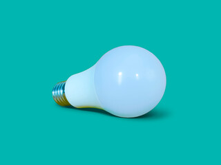 White LED light bulb isolated on turquoise color background.  Lay down position.