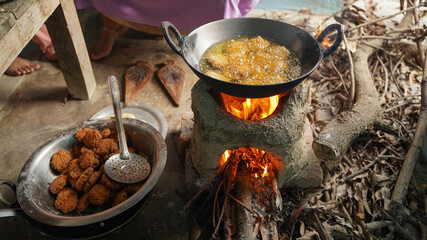Thekua being prepared on stove before chhath puja