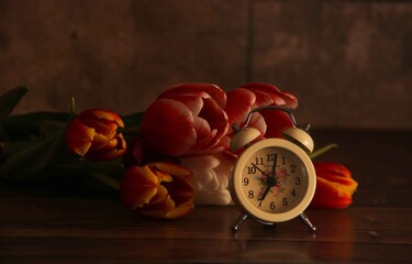 red tulips with old watch