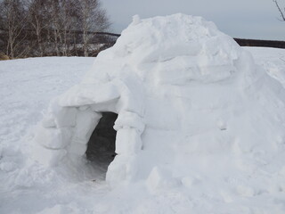 real igloo on the snow, winter cloudy day