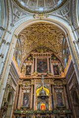 Obraz premium Inside the moorish Cordoba Mezquita Catedral, an impressive gothic and baroque cathedral, built on a mosque in Andalusia, Spain