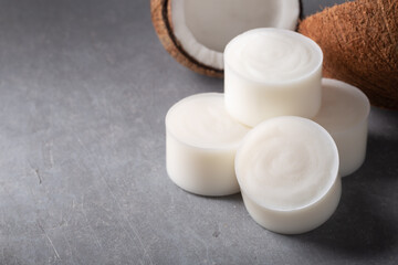 Handmade natural coconut  kitchen soap bar on grey background.