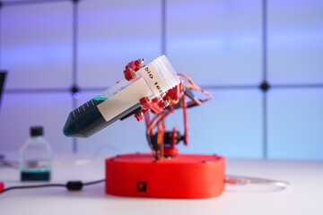 Robot arm with test tube  with biological sample in science laboratory