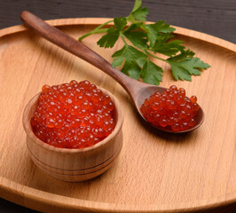 red chum salmon caviar in a wooden bowl, delicious and healthy food