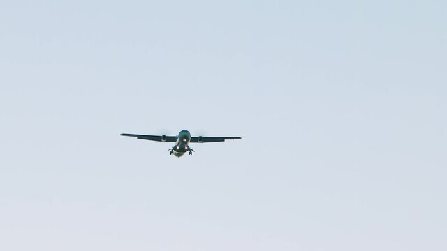 Local airlines, turbo propeller plane flies overhead. 
Propeller cargo plane 