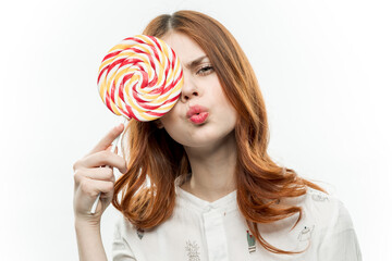 woman in white shirt multicolored lollipop in hands charm delight dessert