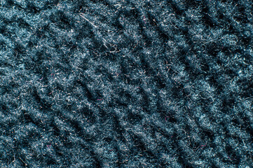 Warm warming fabric based on gray fleece material close-up, macro photography