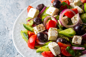 Greek salad with fresh vegetables, feta cheese and kalamata olives. Healthy food.