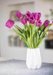 A bouquet of lilac tulips in a vase . A greeting card. Delicate flowers. Valentine's day. March 8. Mother's Day. Copy space