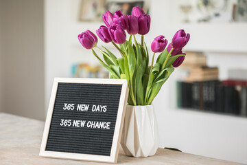 365 new days, 365 new chances. Letter board with motivational quote. New year resolutions and goal setting, self improvement and development concept.