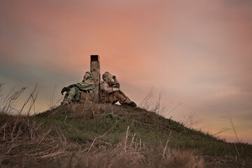 two men in radiation protection suits and gas masks. Radiation pollution. the man and woman were...