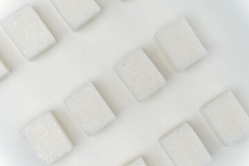 Fototapeta na wymiar sugar cubes glucose ingredient calories energy light background