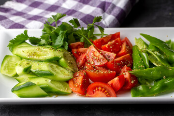 Sliced cucumber, tomato and pepper (Turkish name; sogus)