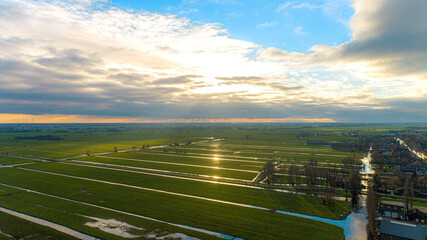Fototapeta premium Green fields with sun breaktrough