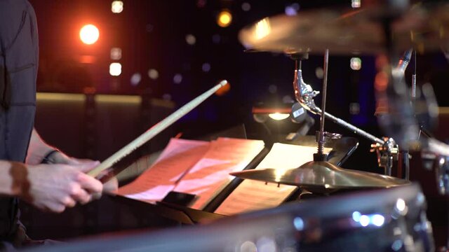 Close-up shot footage of hi-hat being used by professional musician playing drums in his studio