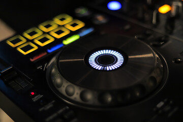 Fototapeta na wymiar DJ remote mixer. Night life at the club