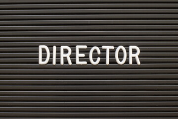 White alphabet in word director on black color felt letter board background