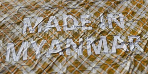 Textile with printed MADE IN MYANMAR text, national fabric production concept, 3d rendering