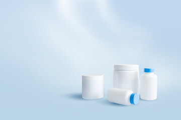 White empty sports nutrition containers on blue background