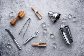 Top view of bar accessories with a cocktail shaker