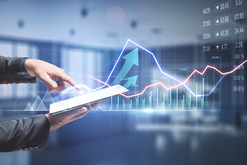 Forex trade market concept with businessman with digital tablet at stock market chart background
