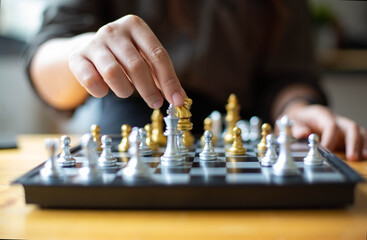 A woman sitting in chess May be interpreted in the planning of the competition in the business.