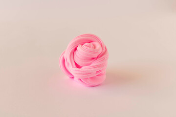 Rose made of solid plasticine on a light background. The concept of children's creativity.