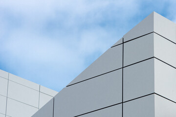 The exterior wall of a contemporary commercial style building with aluminum metal composite panels...