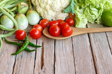 Raw mixed vegetables on wooden table