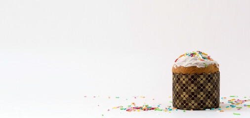 easter cake with colored sprinkles on white background