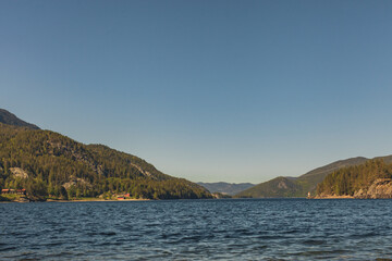 Fototapeta na wymiar Lake in valley, landscape in sunny day