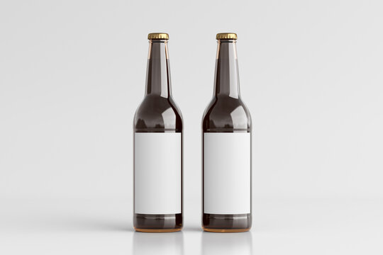 Two beer bottles 500ml mock up with blank label on white background.