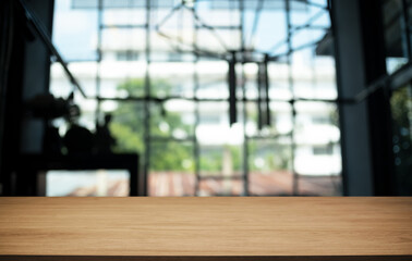 Empty wooden table in front of abstract blurred background of coffee shop . can be used for display or montage your products.Mock up for display of product