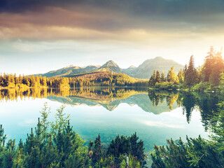 Calm lake in National Park High Tatra. Location place Strbske pleso, Slovakia, Europe.