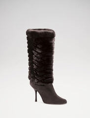 Fashionable women boots for all seasons. Studio shoot