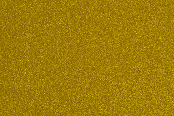 Yellow background with a fine texture. An empty flat and clean surface for information. The backdrop is advertising. Trend Color