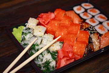 asian food sushi and roll set wooden sticks seafood