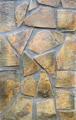 Stone building wall fasade in concrete.Light yellow masonry made of natural stone.