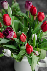 Red tulips in a vase close up