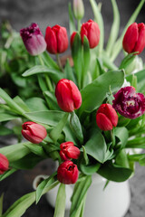 Red tulips in a vase close up