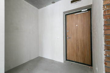 interior of the apartment without decoration in gray colors. rough finish