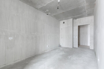 interior of the apartment without decoration in gray colors. rough finish